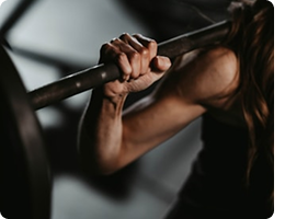 Person lifting a barbell during a workout