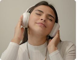 Woman enjoying music while wearing headphones